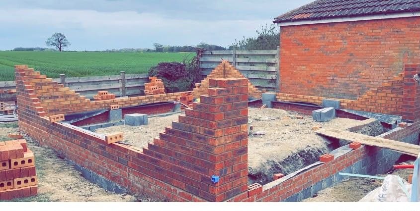 Garden room brickwork rising from the footings