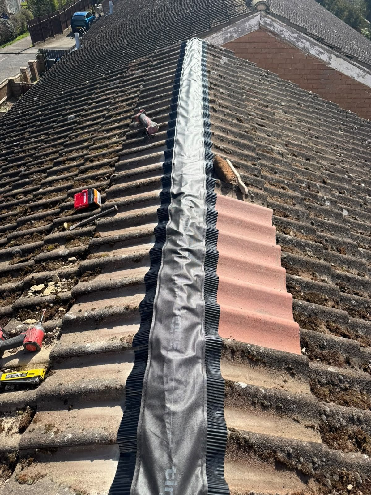 Old tiles stripped and dry ridge system going on